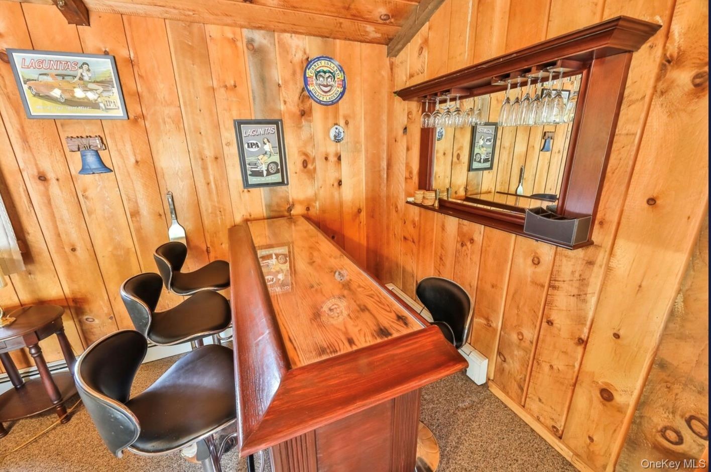 Office space with wooden walls and bar area