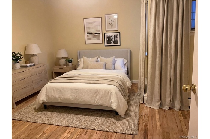 Very spacious bedroom. hardwood flooring. Clothes closets