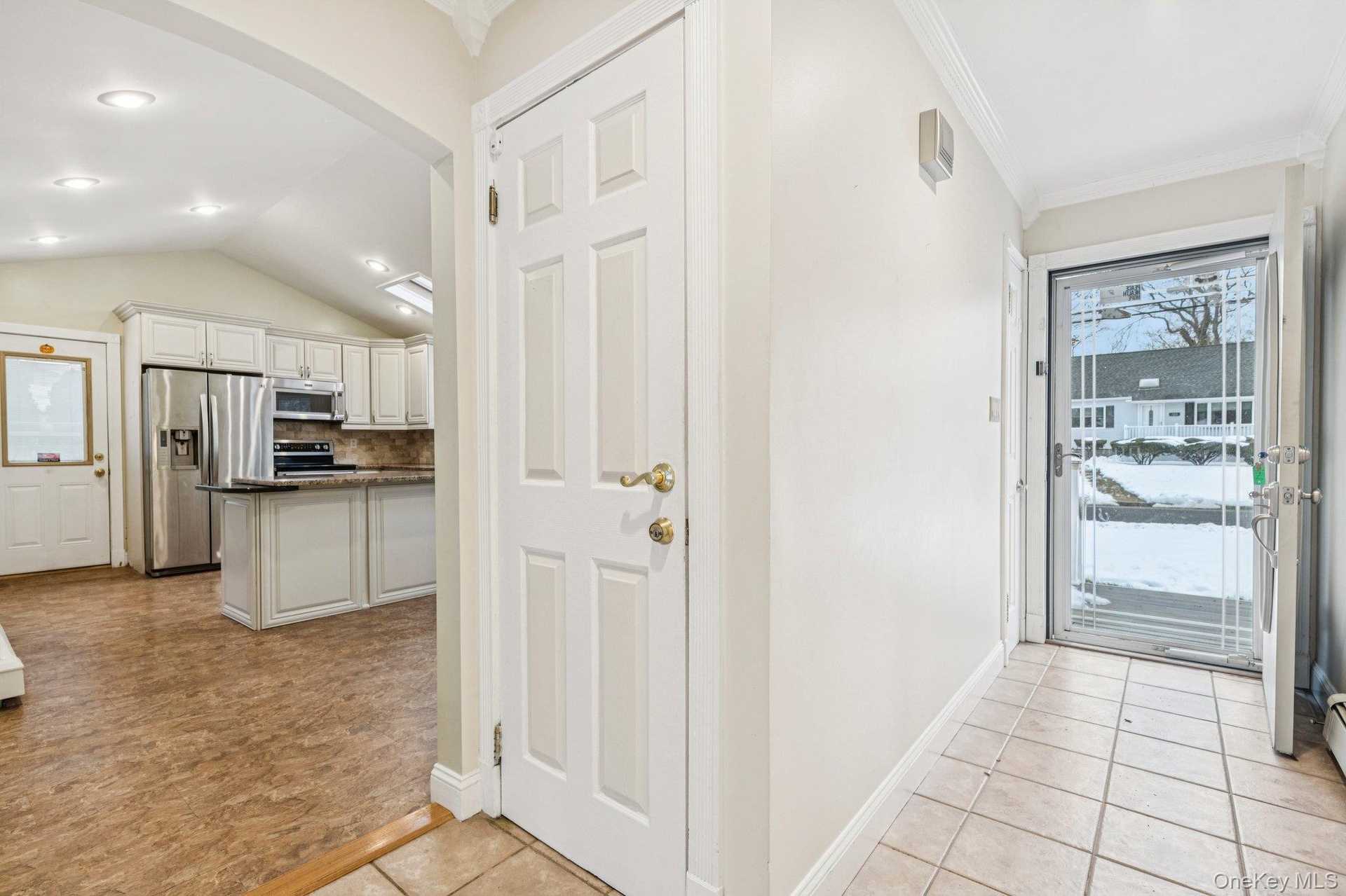 Entry Hallway to the Living Room, Kitchen and Basement