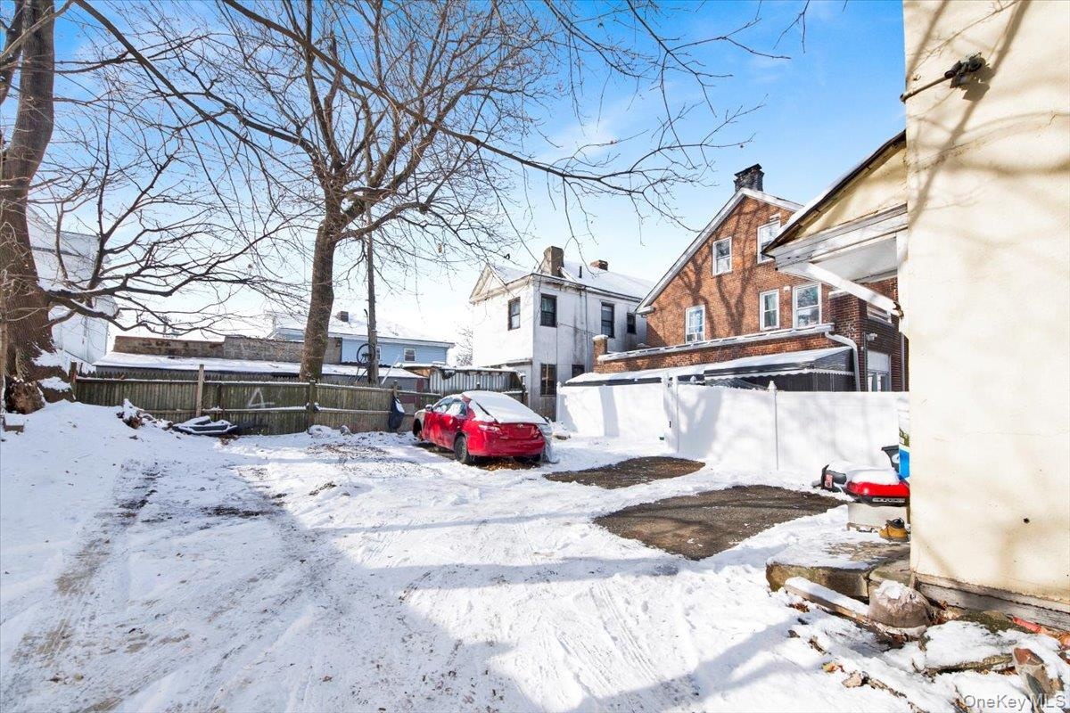 View of yard covered in snow
