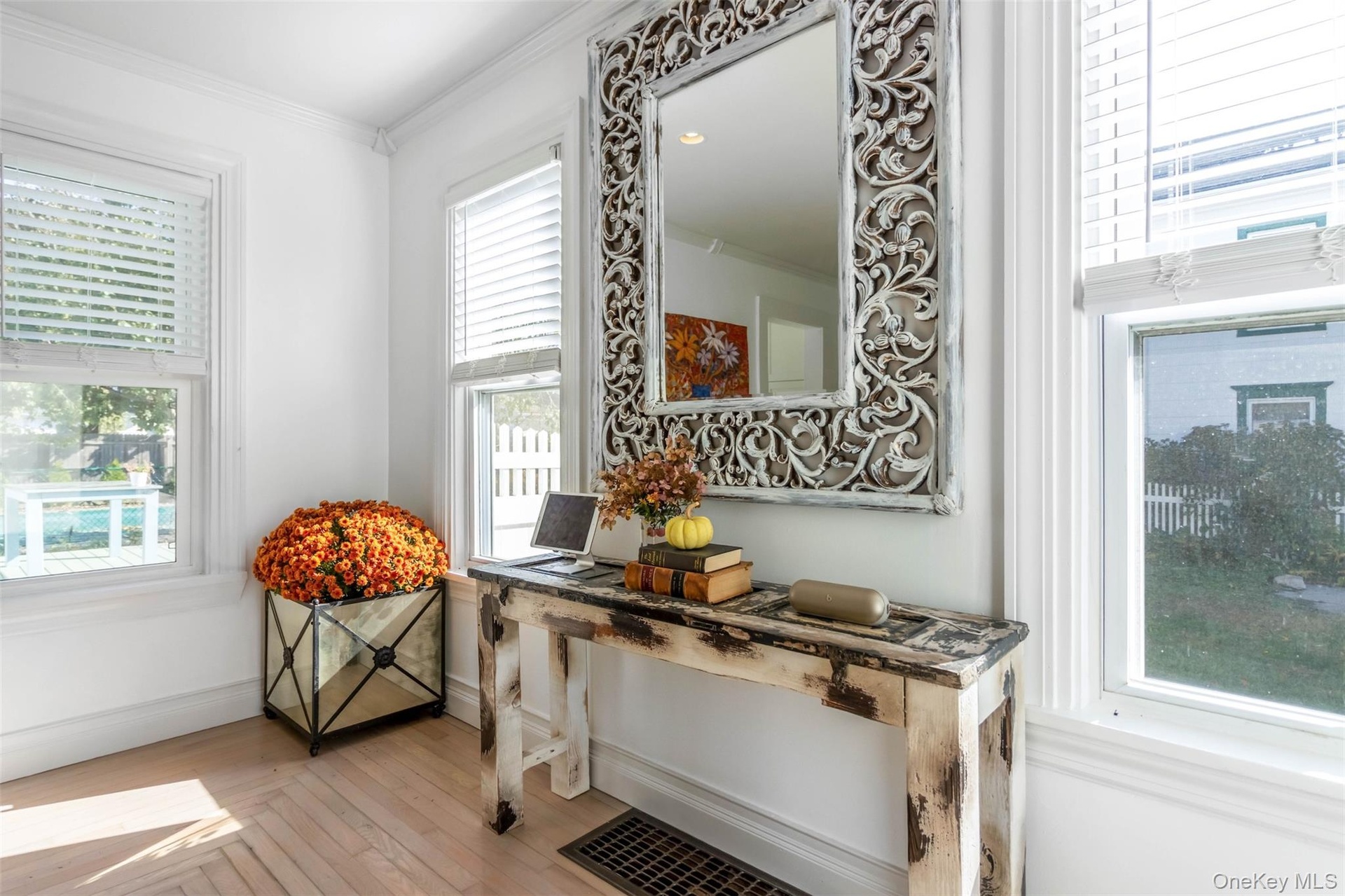 Detailed view of crown molding and wood finished floors