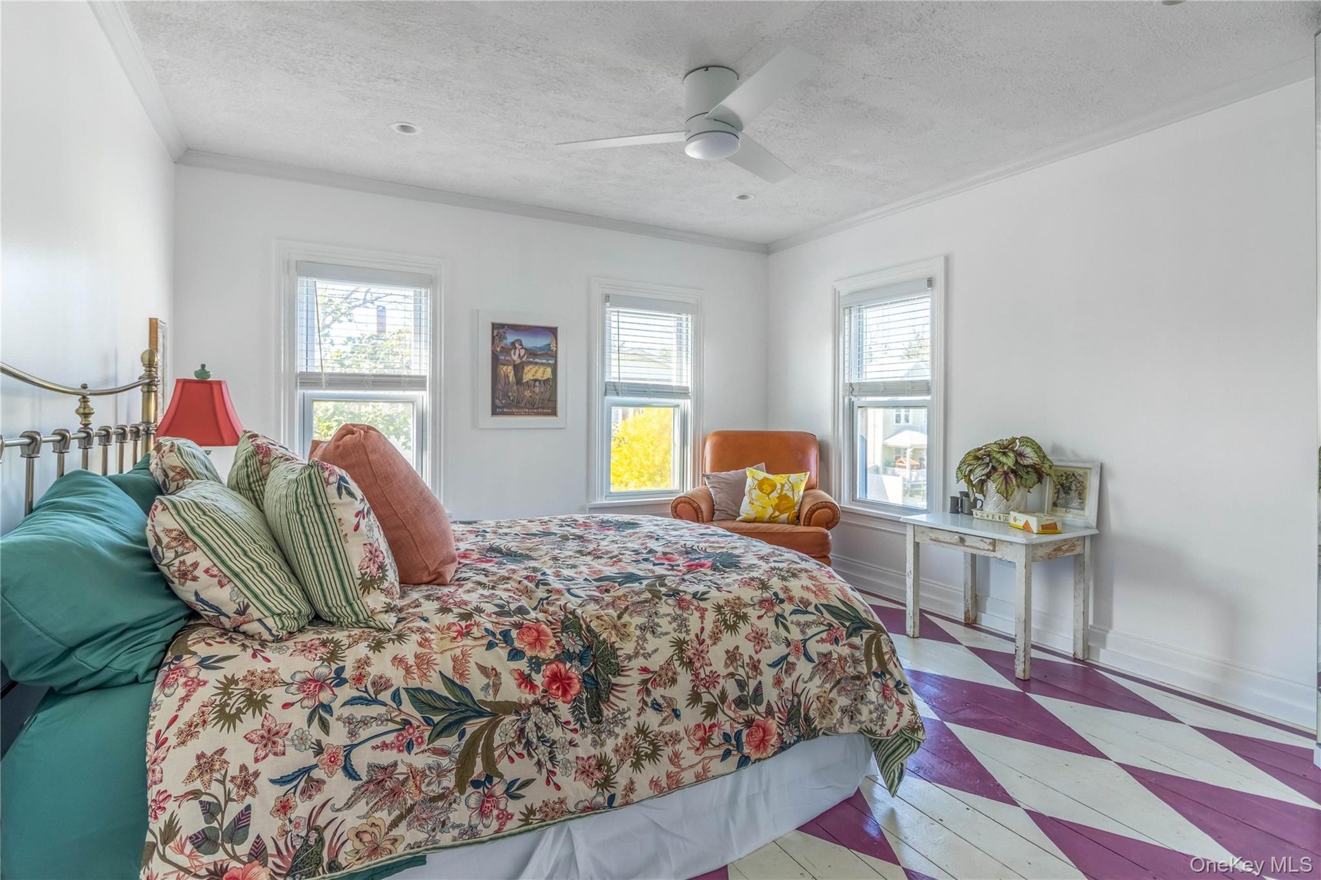 Bedroom with a textured ceiling, a ceiling fan, and crown molding