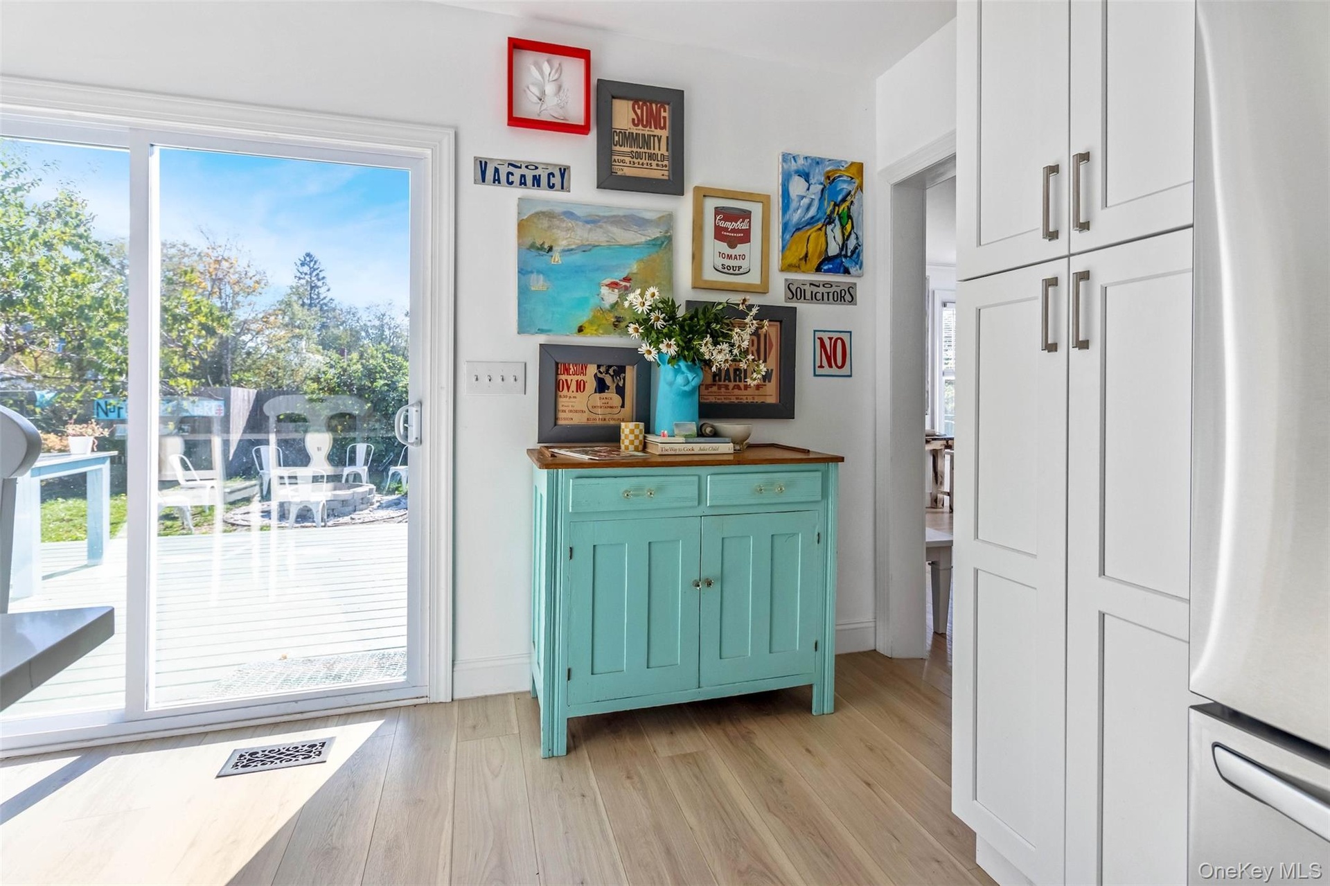 Doorway to outside featuring wood finished floors and baseboards