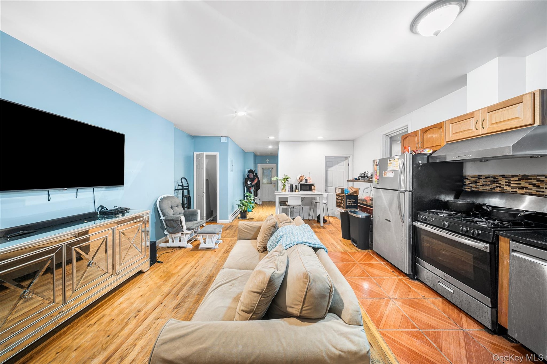 Kitchen featuring appliances with stainless steel finishes, tasteful backsplash, under cabinet range hood, and recessed lighting