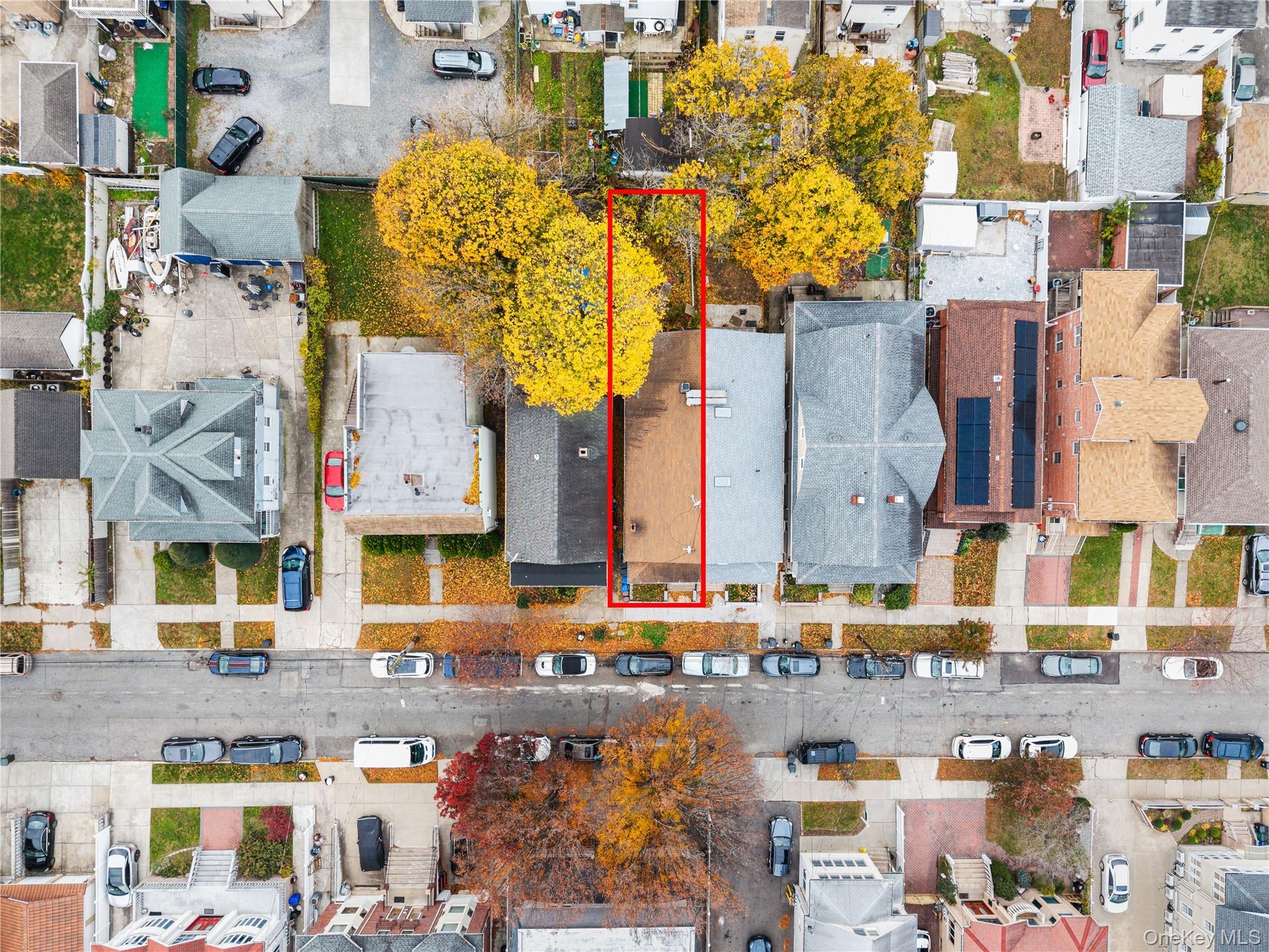 Aerial perspective of suburban area featuring property parcel outlined