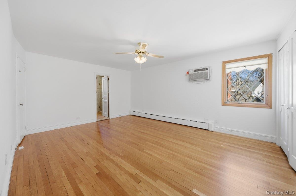 Newly painted with refinished original hardwood oak flooring, ceiling fan