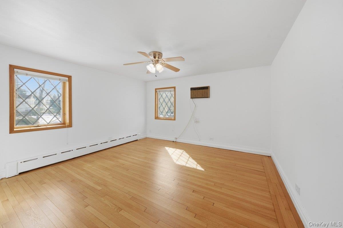 2nd bedroom, freshly painted, refinished original hardwood oak flooring, ceiling fan