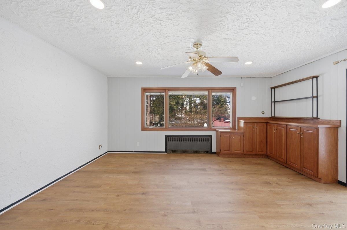 Also used as a den, new LVP flooring, ceiling fan