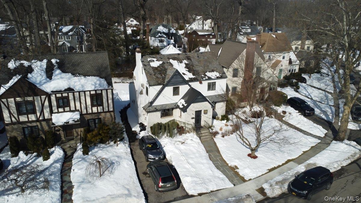 Driveway accommodates multiple vehicles, rear entry attached garage