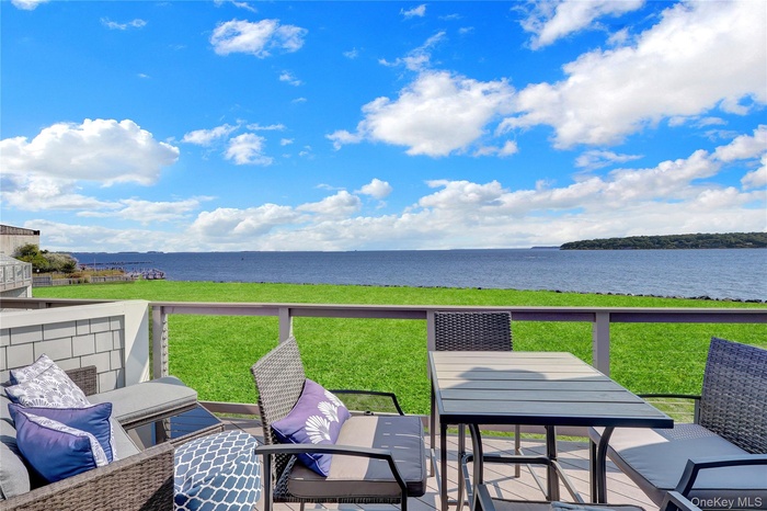 This is the magic space. Just off the living room you have privacy from the neighbors and an amazing  waterfront view year round.