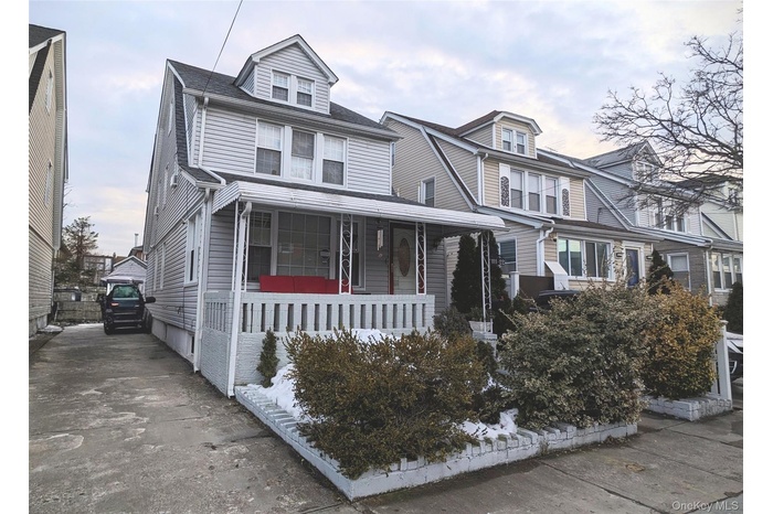View of front of property with covered porch