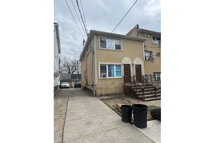 Multi unit property with stucco siding and cooling unit