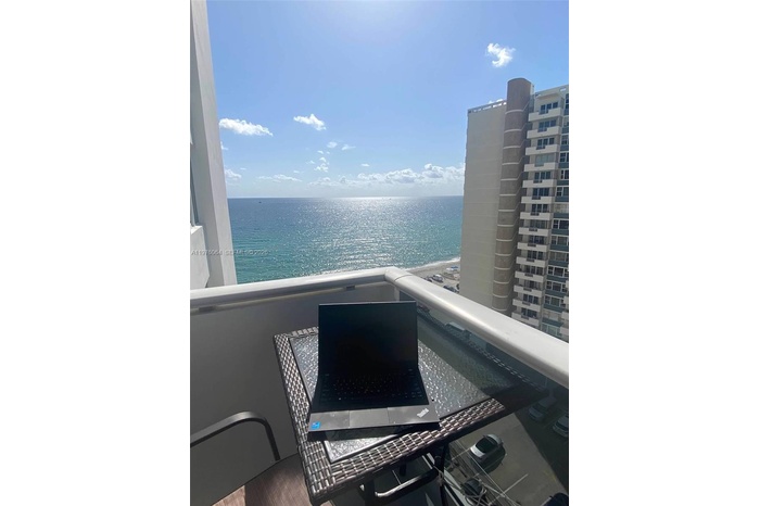 Expansive 11th-floor balcony views capturing wide south-facing vistas of the ocean, bay, and city skyline.