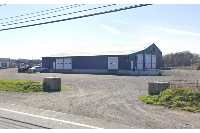 View of front of property with a detached garage