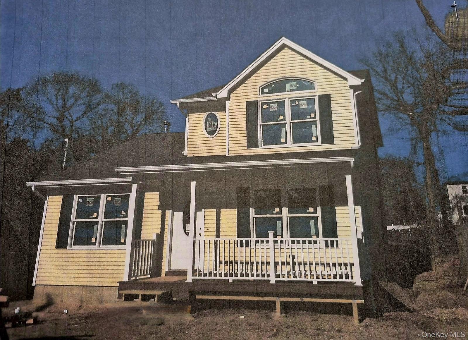 Traditional-style home featuring covered porch