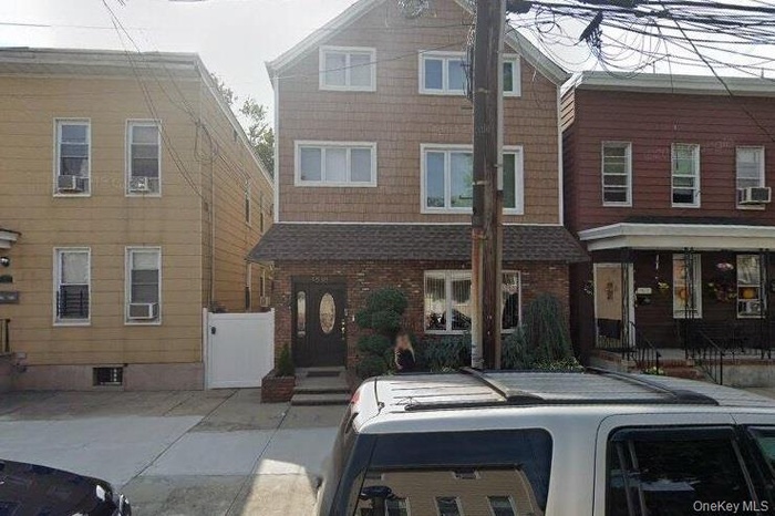 View of front of property with brick siding