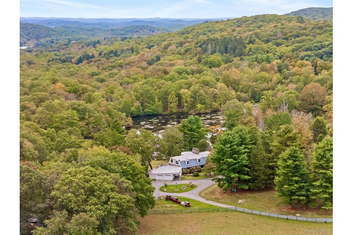View from above of property featuring a forest