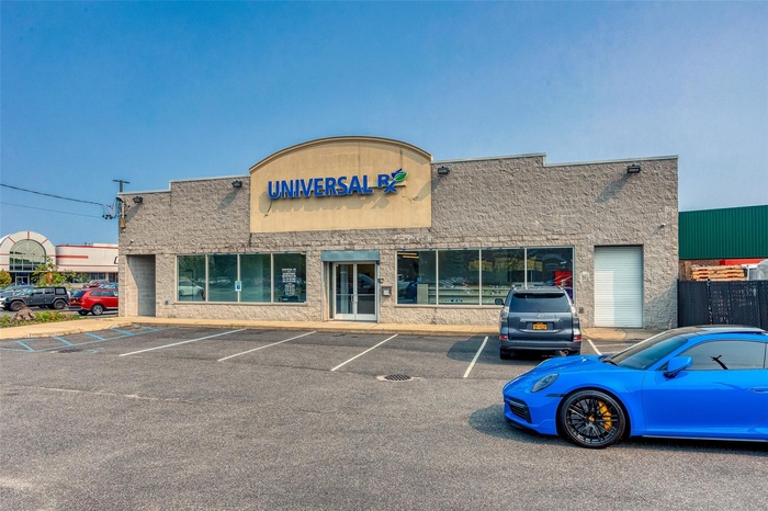 View of commercial location with uncovered parking