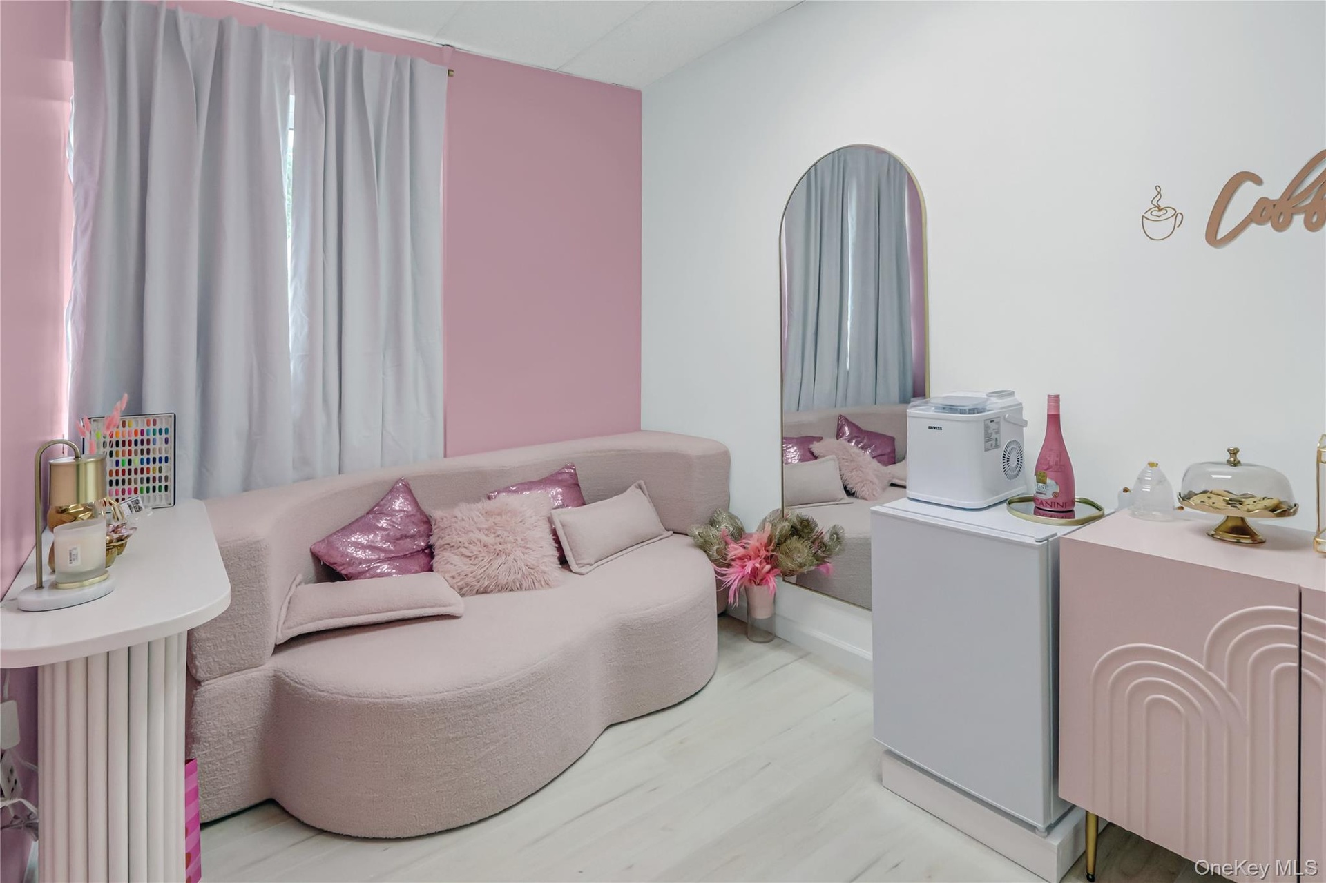 Bedroom featuring light wood-style floors and a drop ceiling