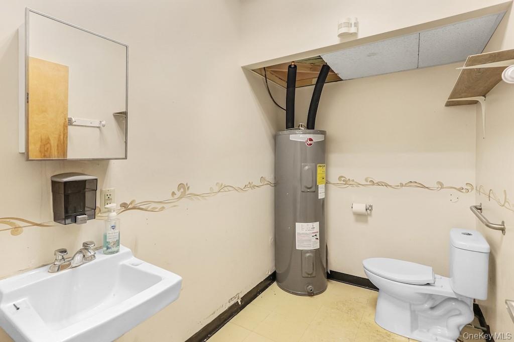 Bathroom with a sink and electric water heater