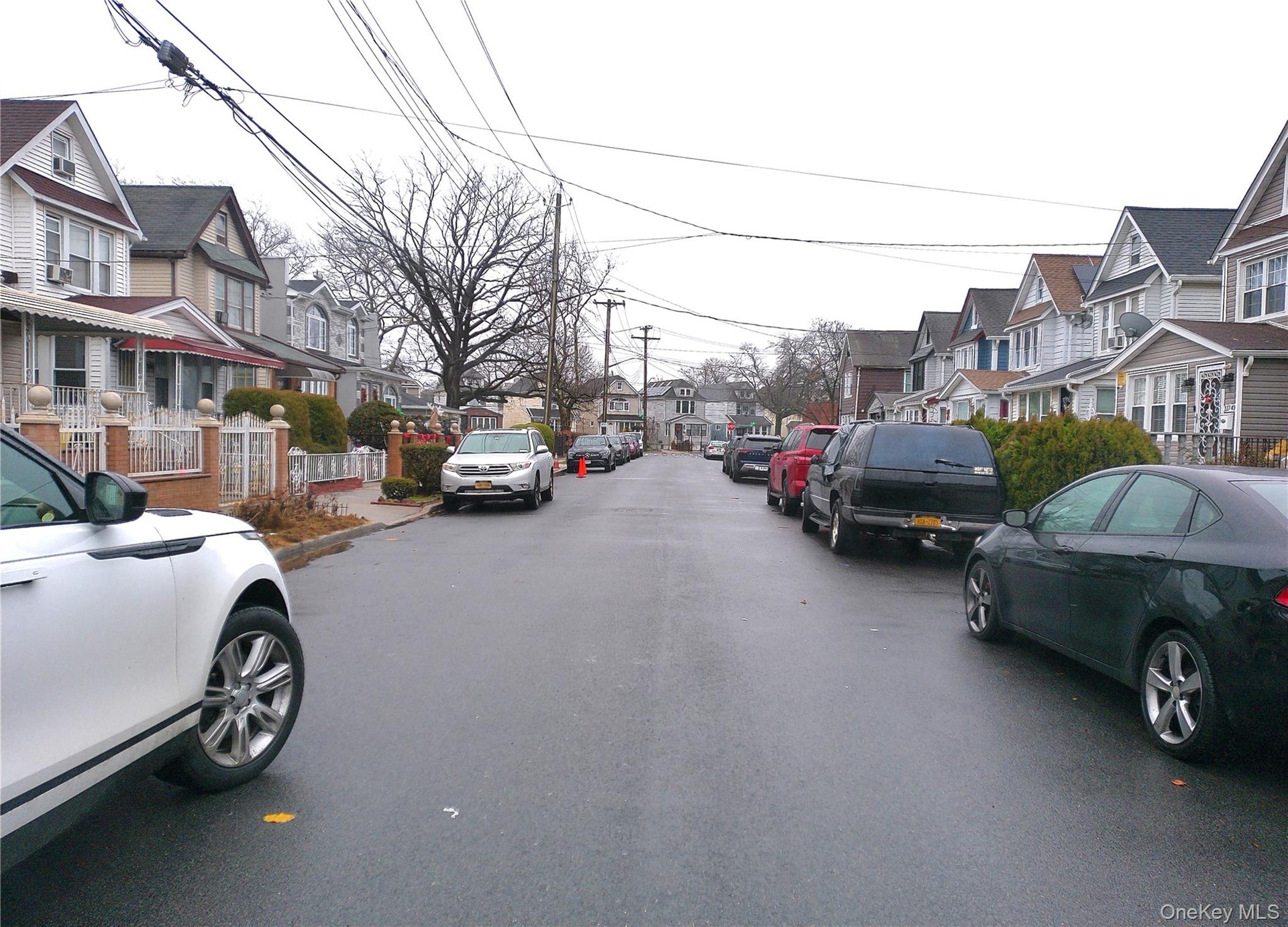 View of asphalt street with a residential view