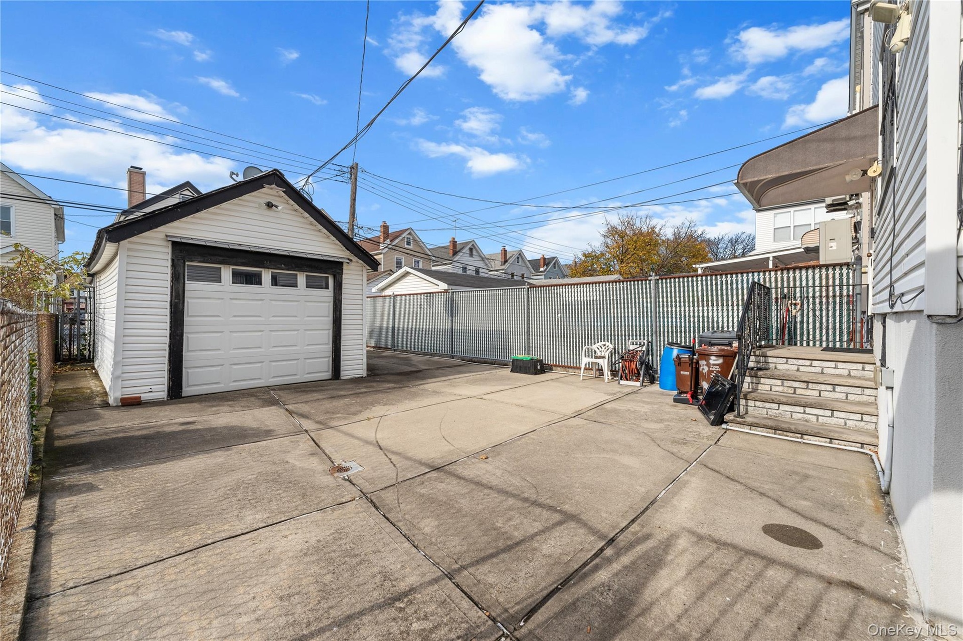 Detached garage featuring driveway