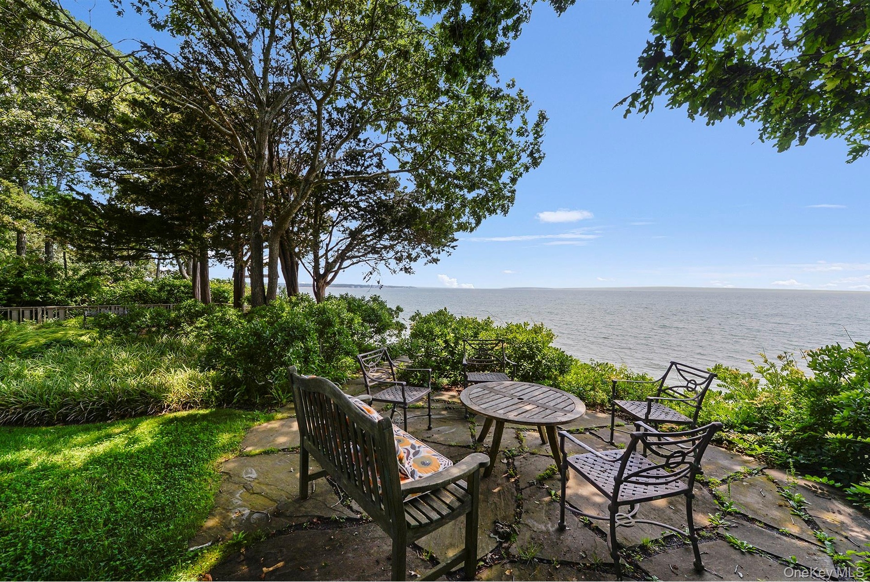 View of patio / terrace with a water view