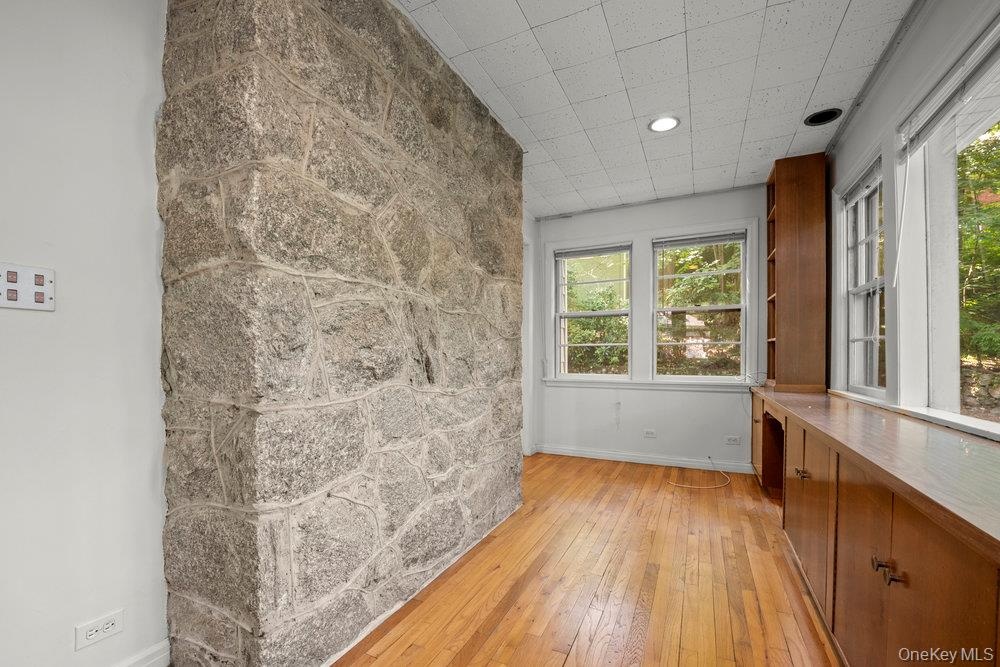 Empty room featuring baseboards and light wood-style floors