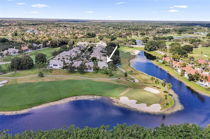 SITUATED ON A PRIME POINT LOT, IN THE EXCLUSIVE BOUTIQUE ENCLAVE OF "THE FAIRWAYS", WITH WRAP-AROUND BREATHTAKING GOLF AND LAKE VIEWS! Zoom in to the 