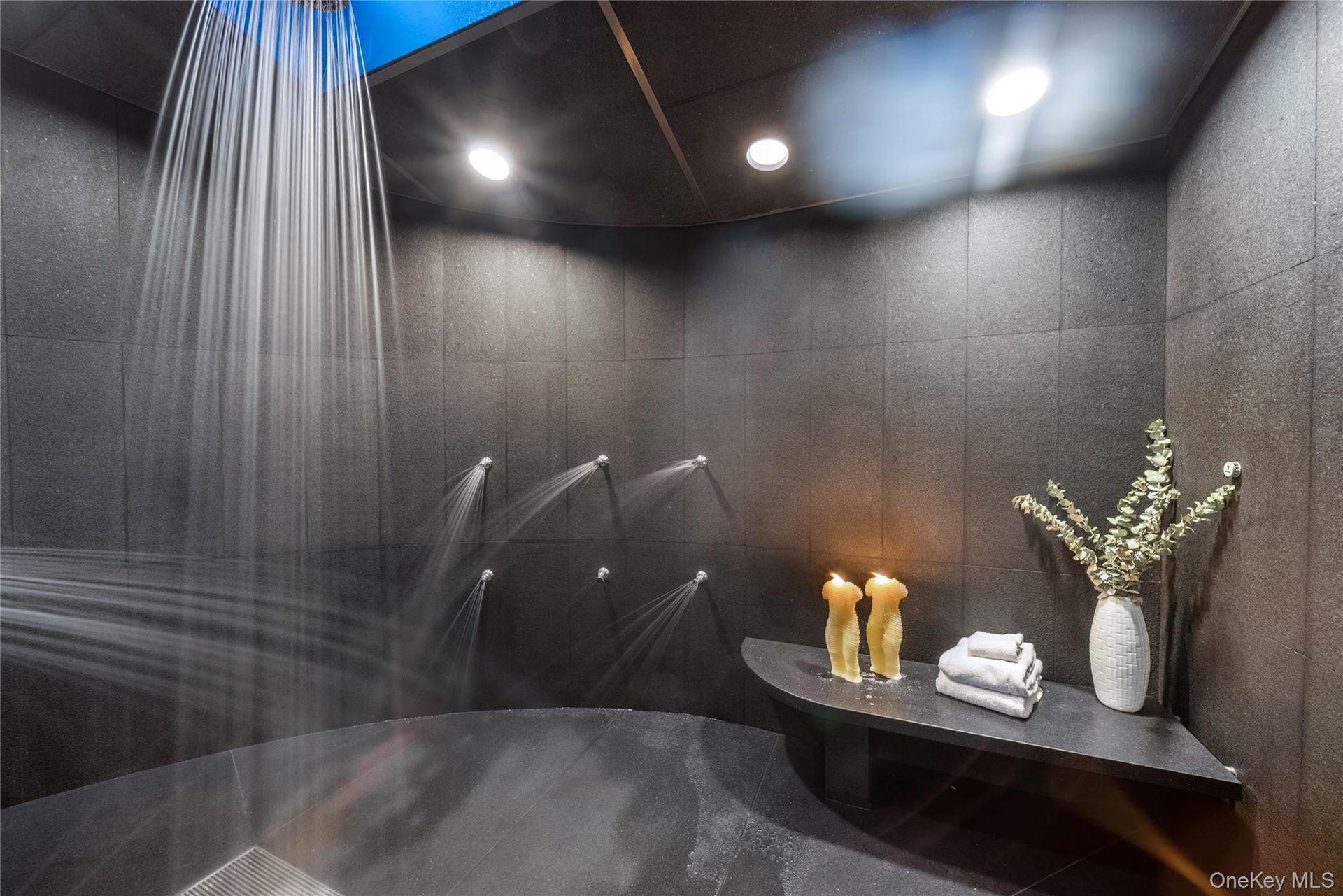 An Expansive Walk-in Steam Shower With Multiple Shower Heads