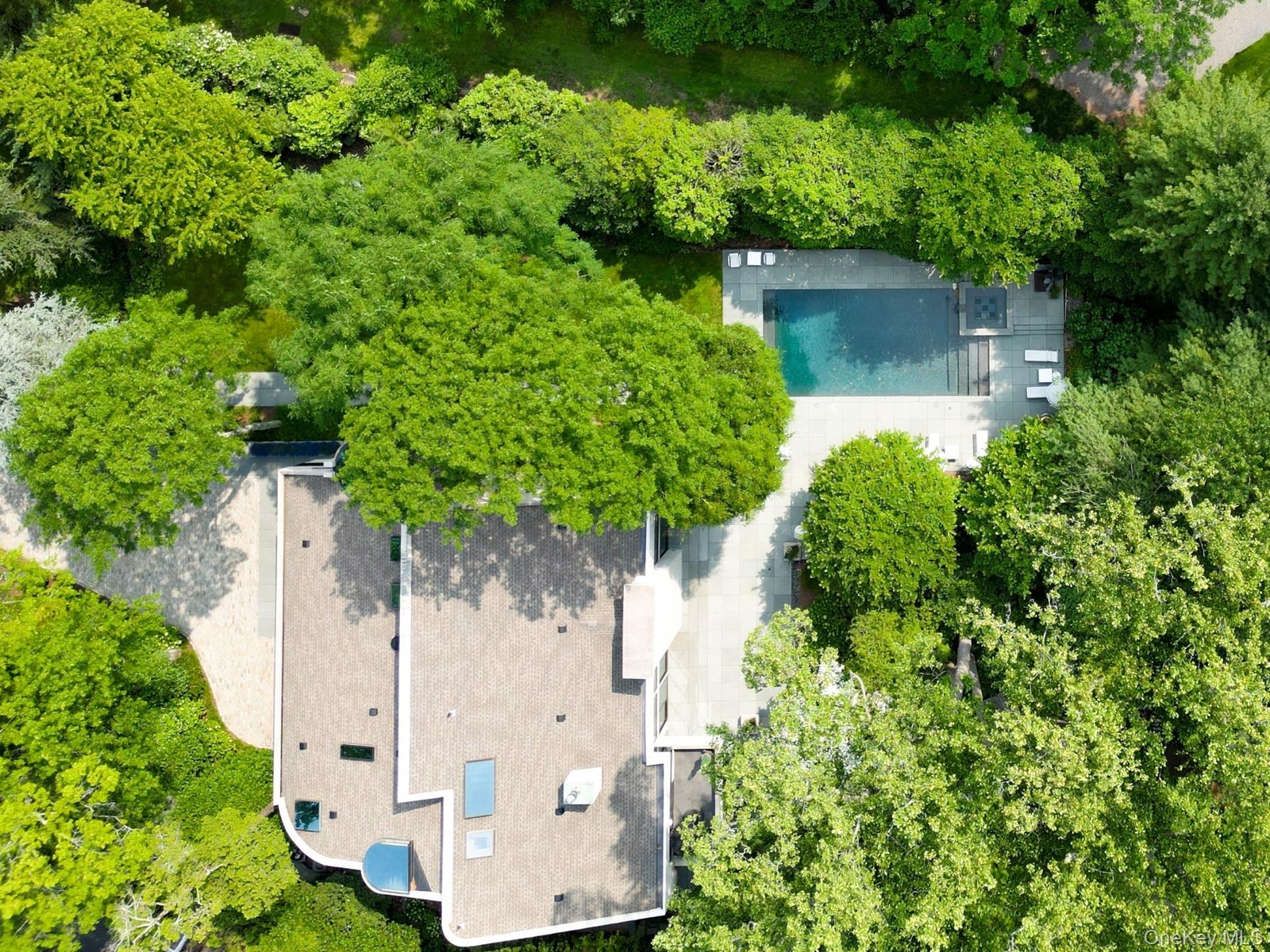 View of subject property featuring a pool area