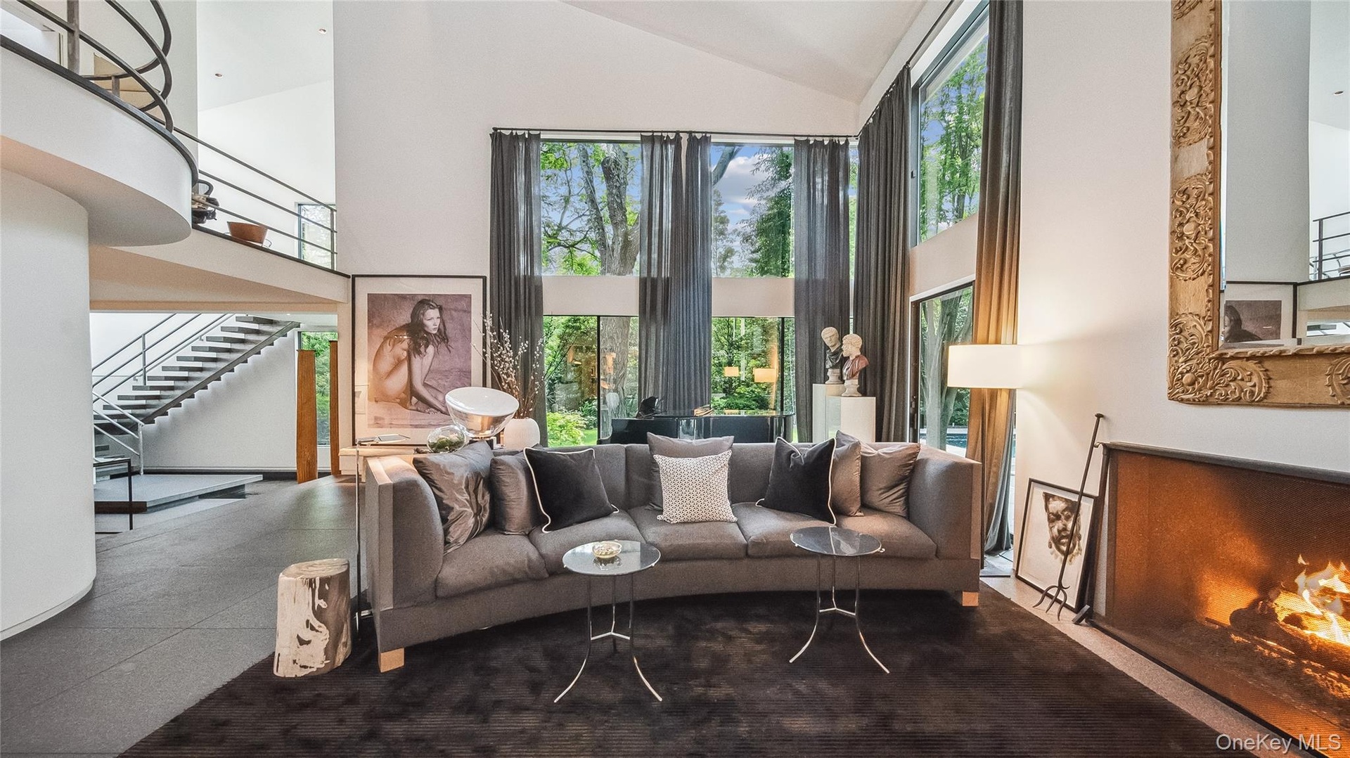 Main Living Area With Double Height Ceilings and Gas Fireplace