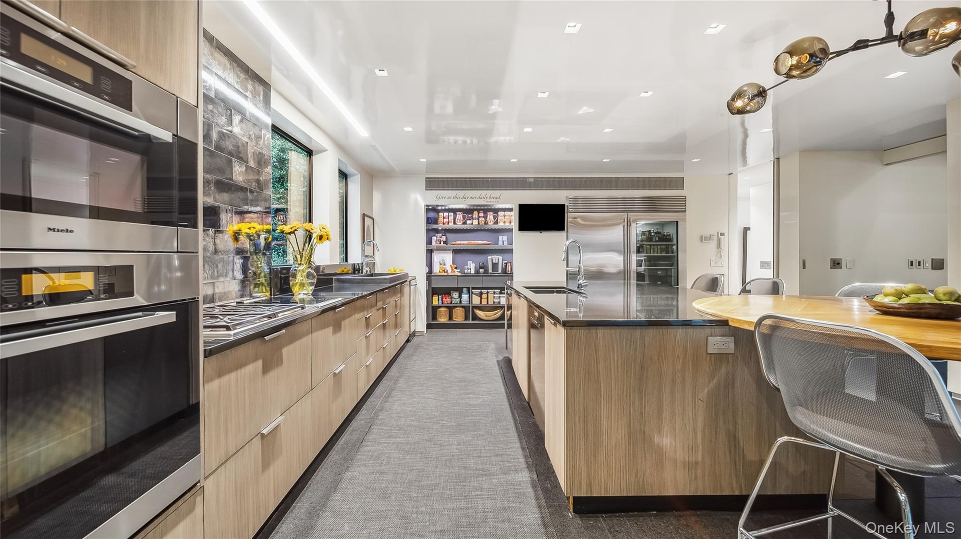 Custom Stained Rift European Oak Cabinetry, Stainless Steel Miele, Wolf, and Sub-Zero Appliances
