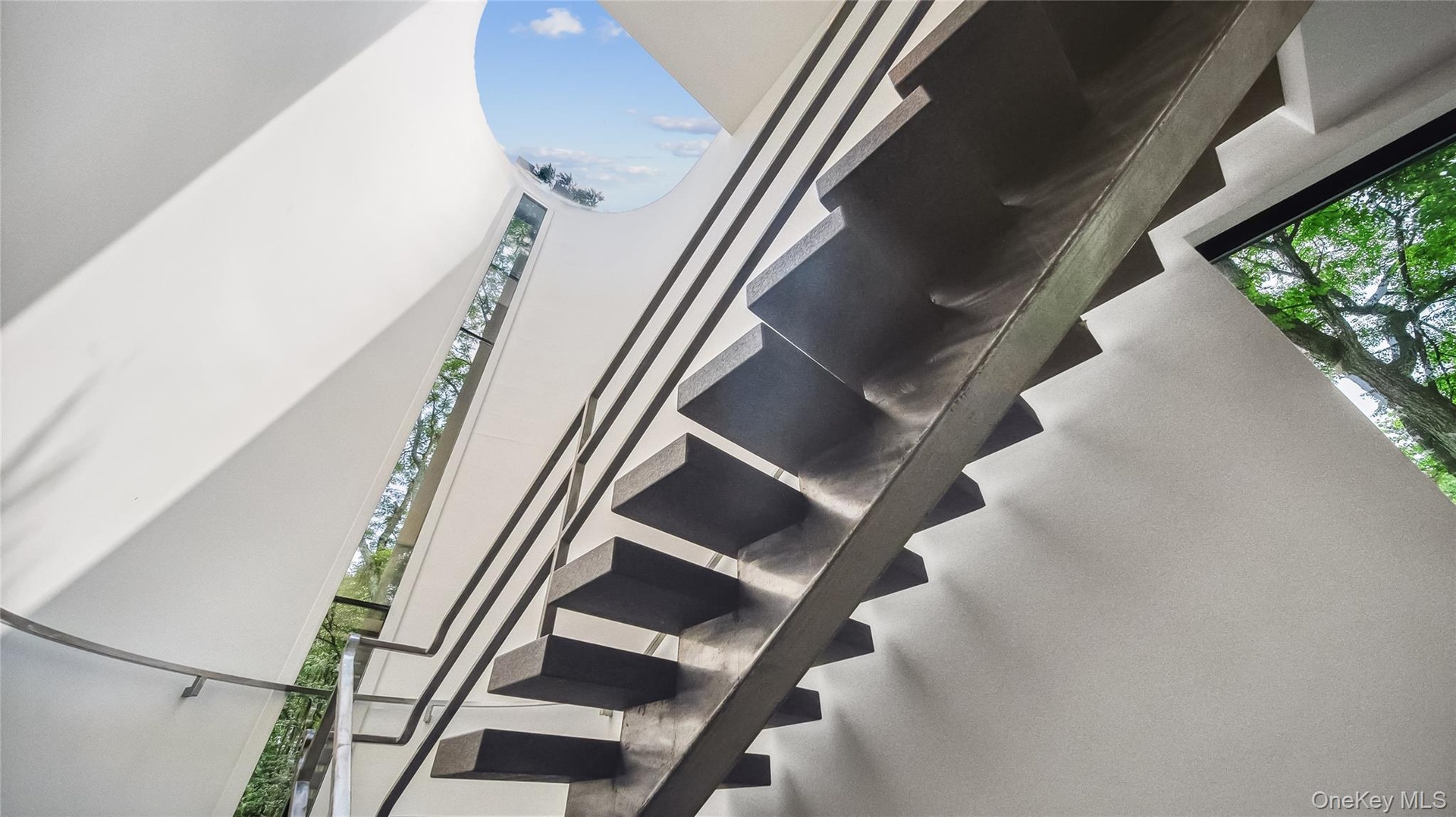 Sculptural Staircase With Cantilevered Granite Steps