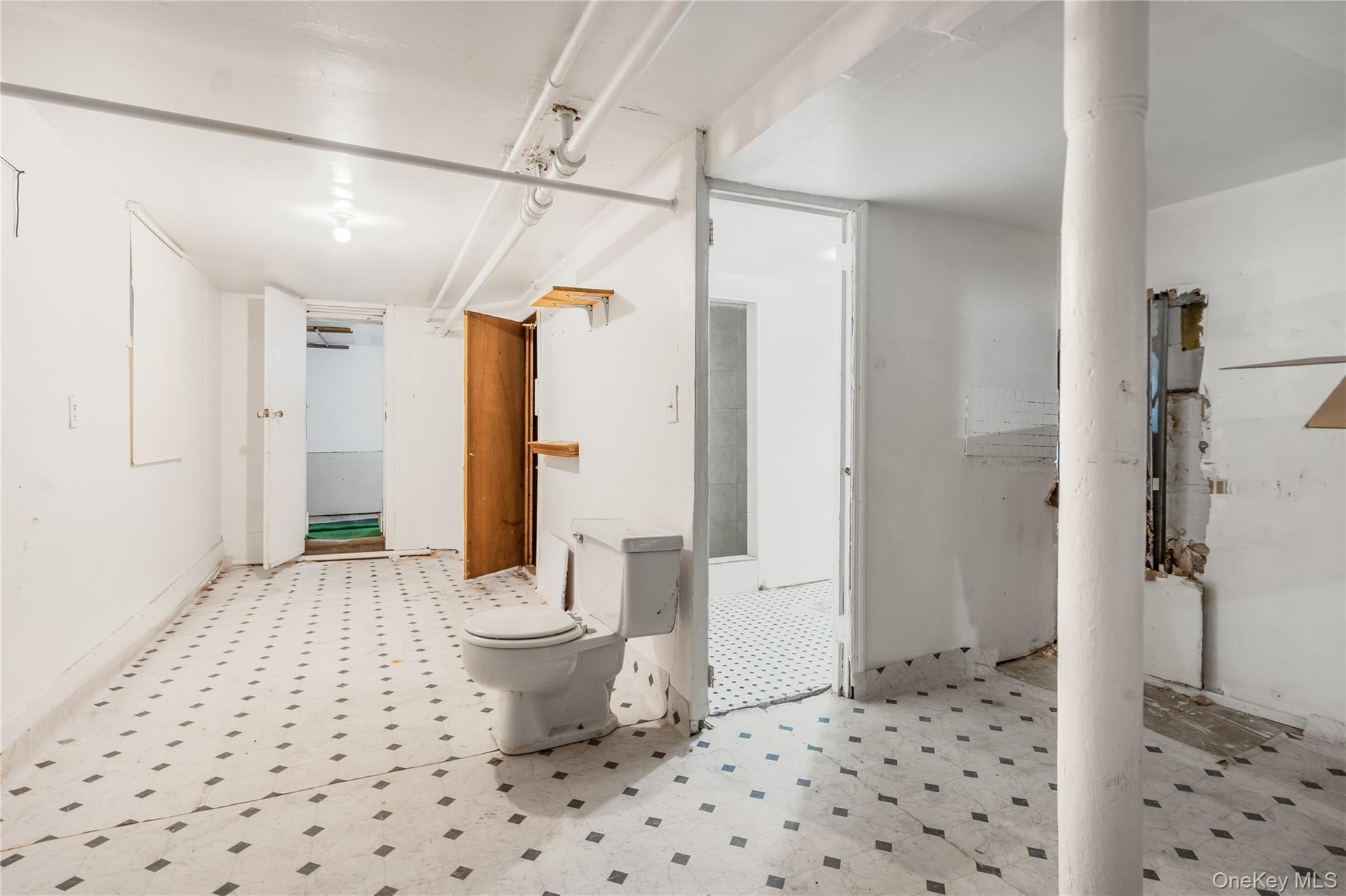 Bathroom featuring tile patterned floors and toilet