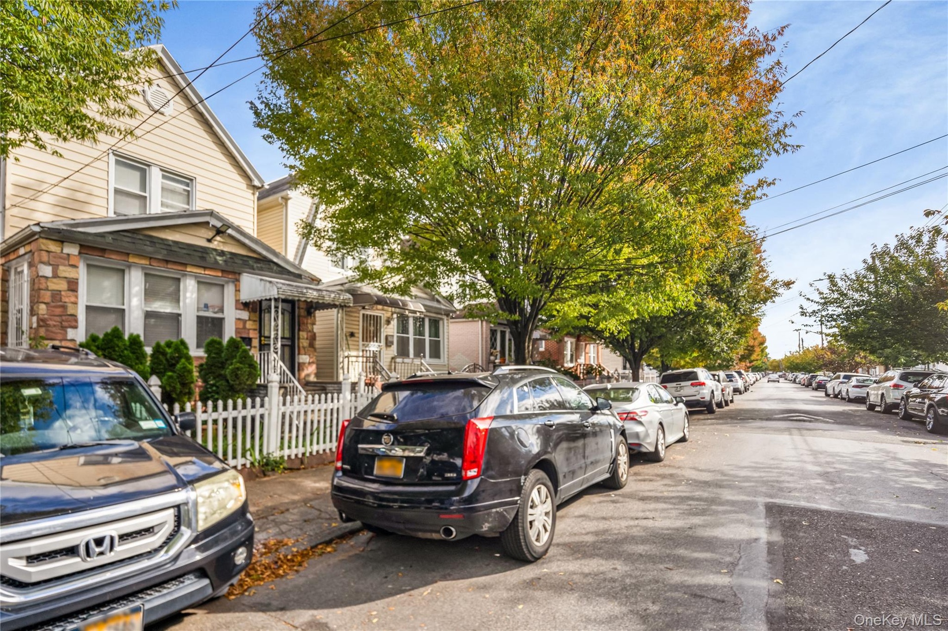 View of asphalt street featuring a residential view