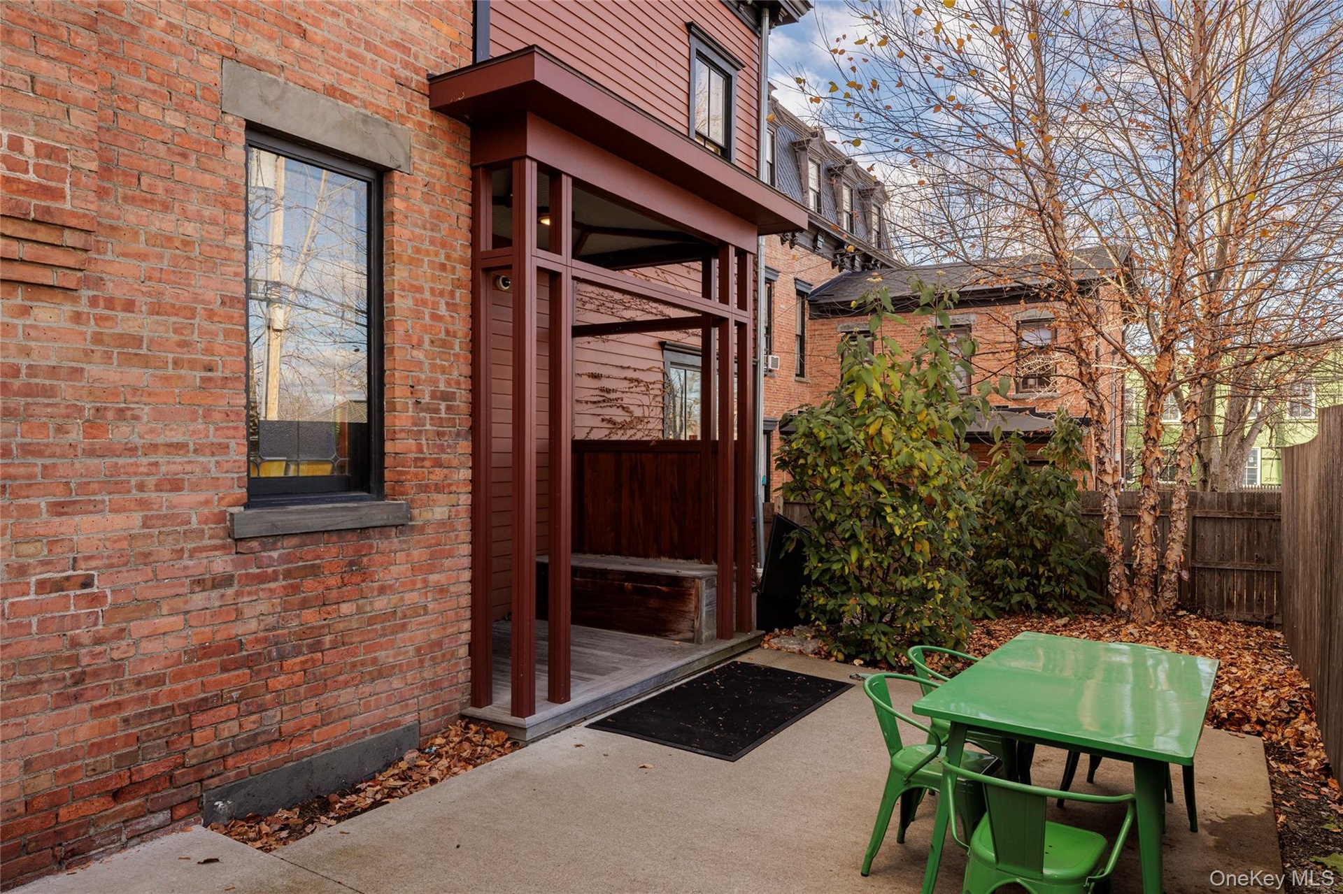 Doorway to property featuring brick siding