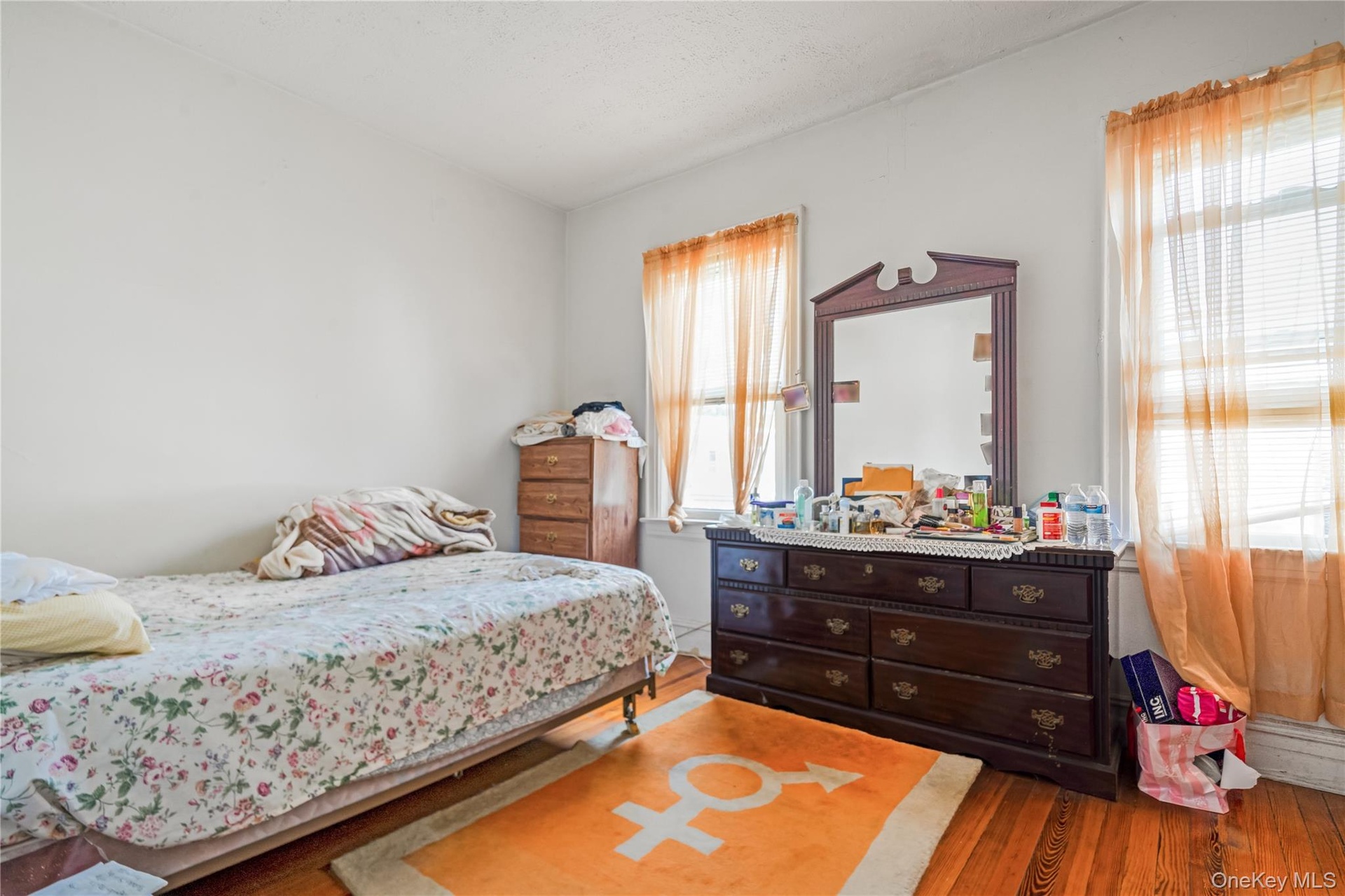 Bedroom with wood finished floors
