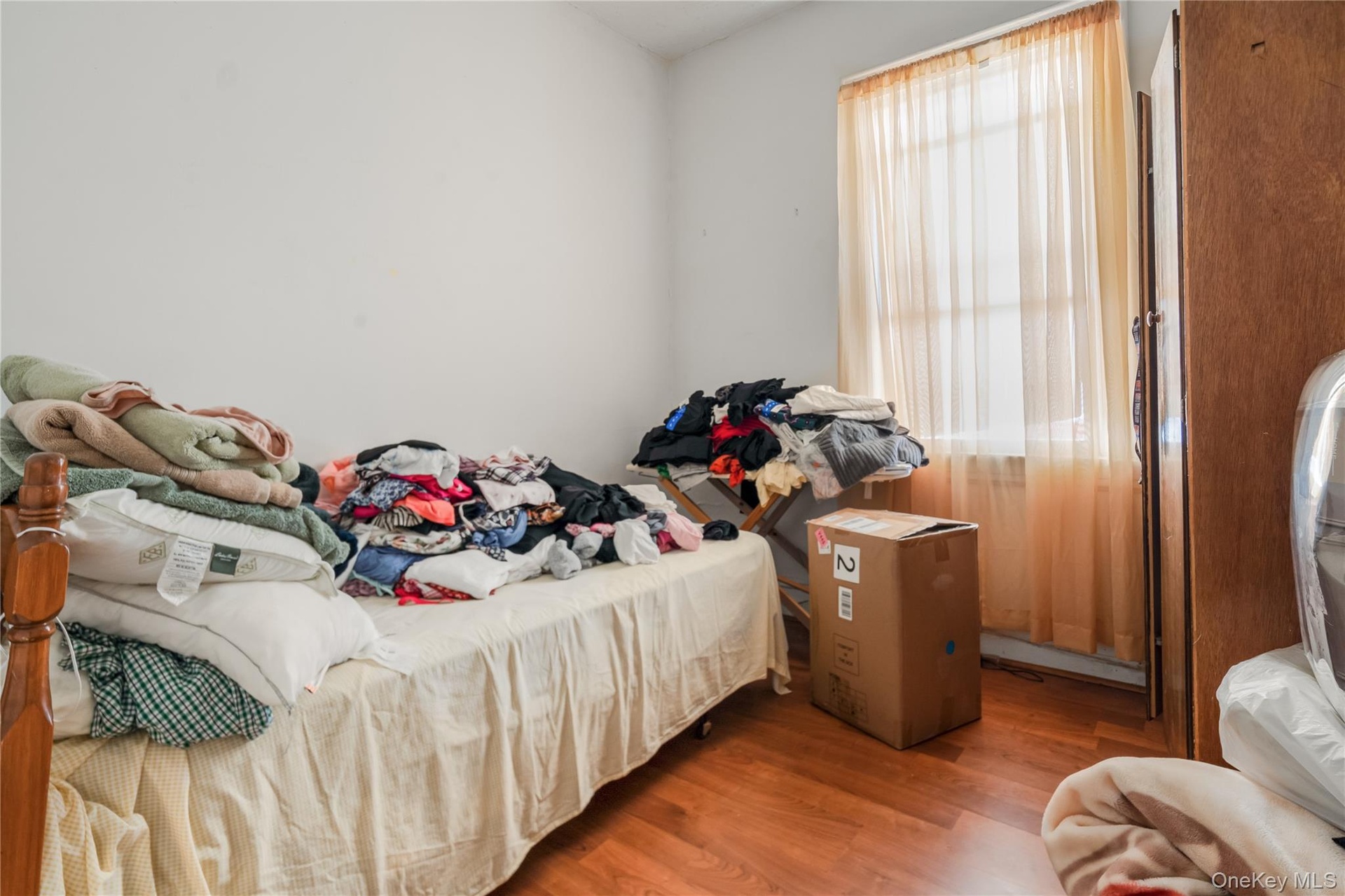 Bedroom with wood finished floors