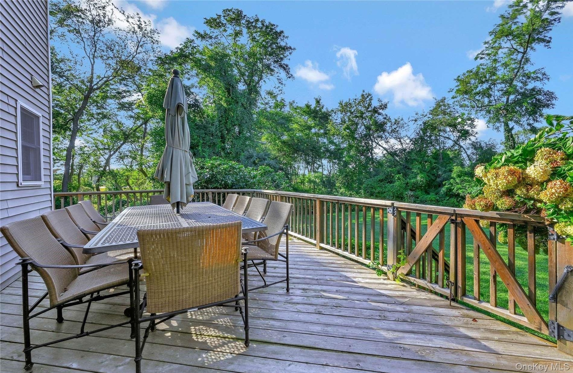 Wooden deck featuring outdoor dining space