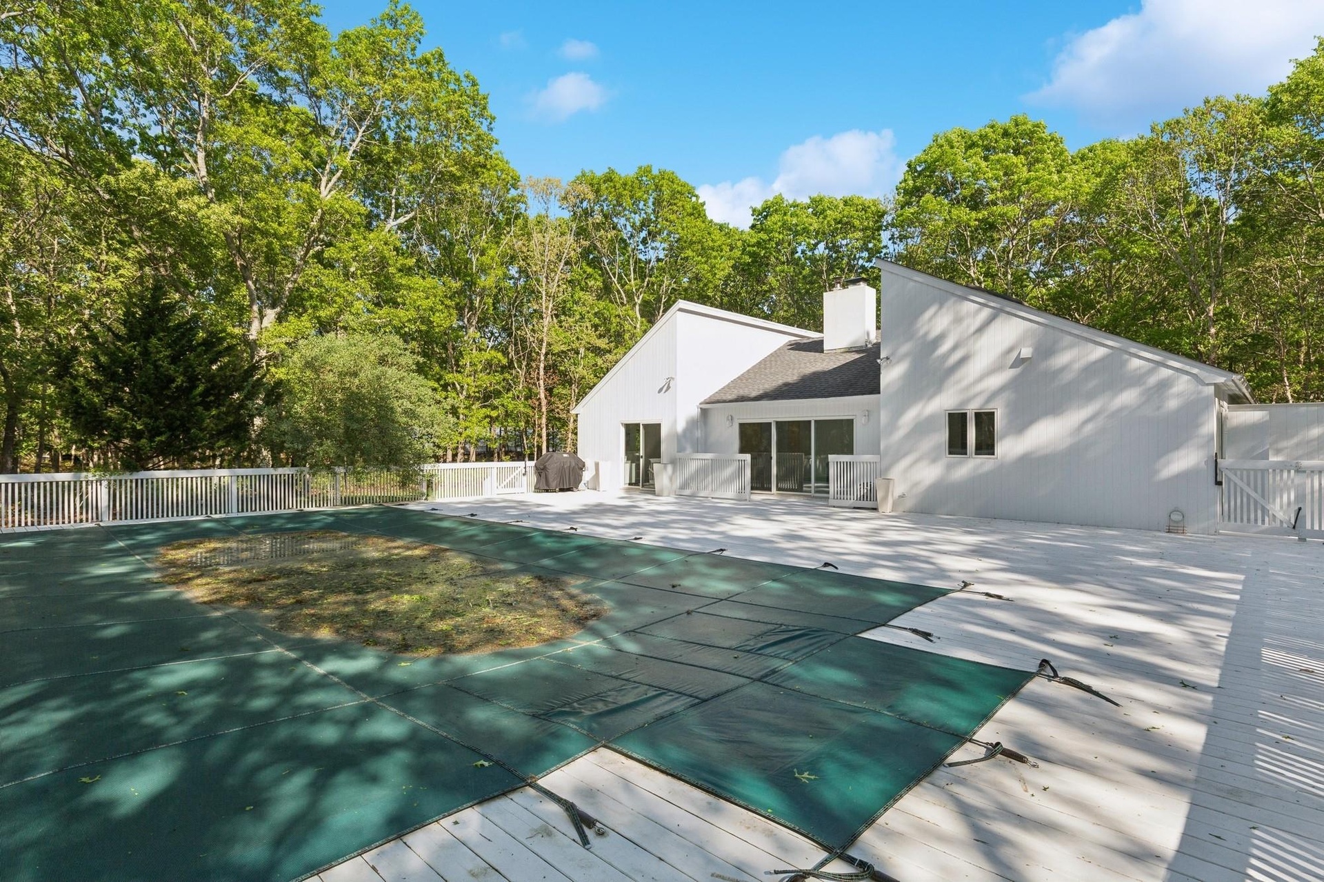 View of pool featuring a gate and a patio area