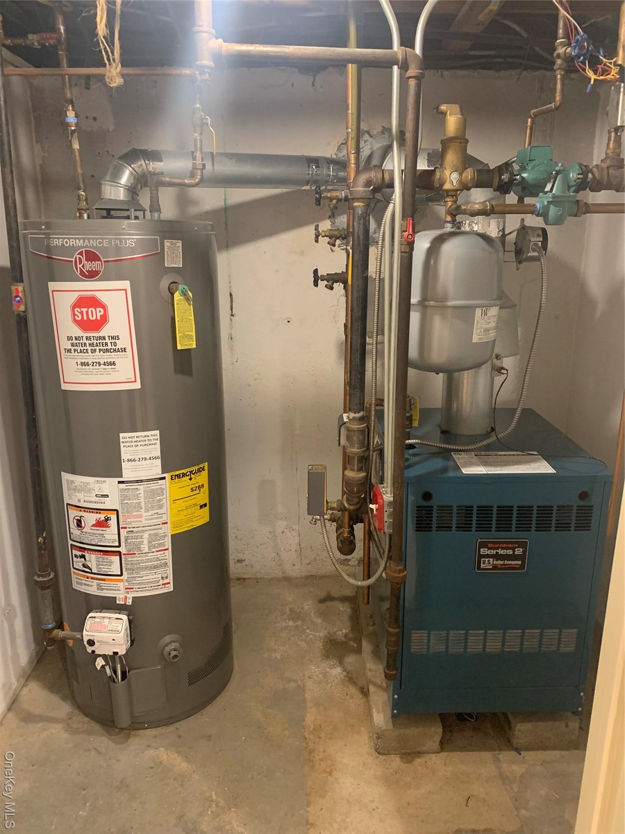 Utilities featuring water heater and a heating unit
