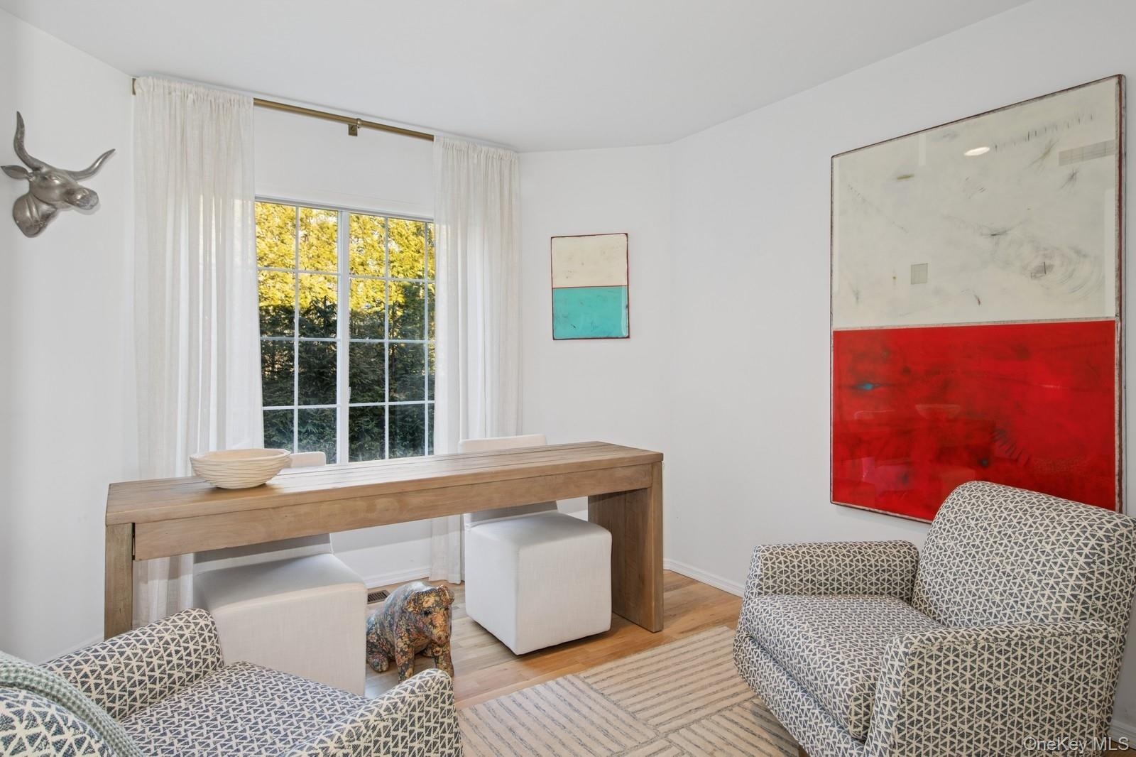 Office area with wood finished floors and baseboards