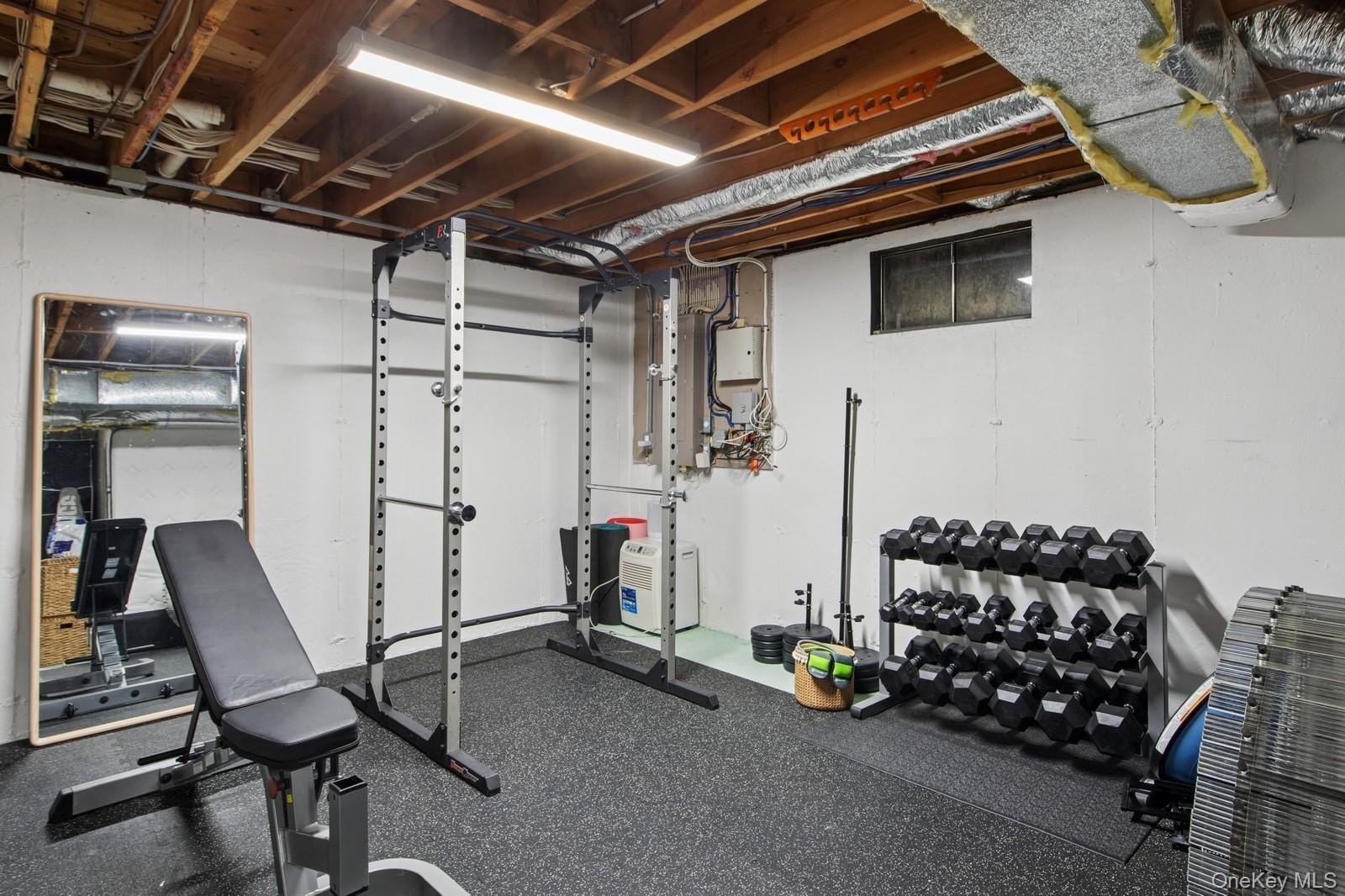 Exercise area featuring rubber floors