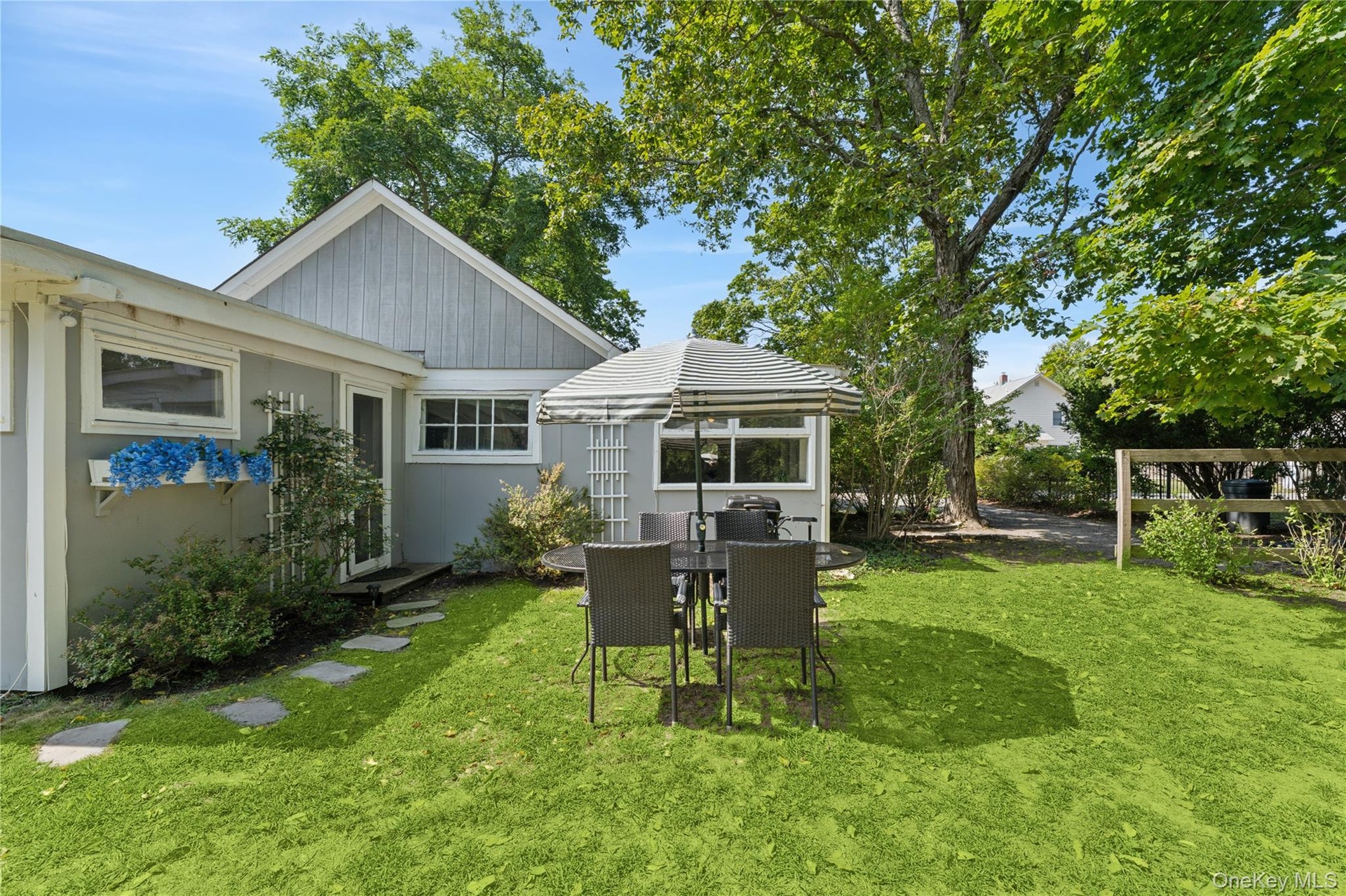Back Yard with seating, grill, and outdoor shower