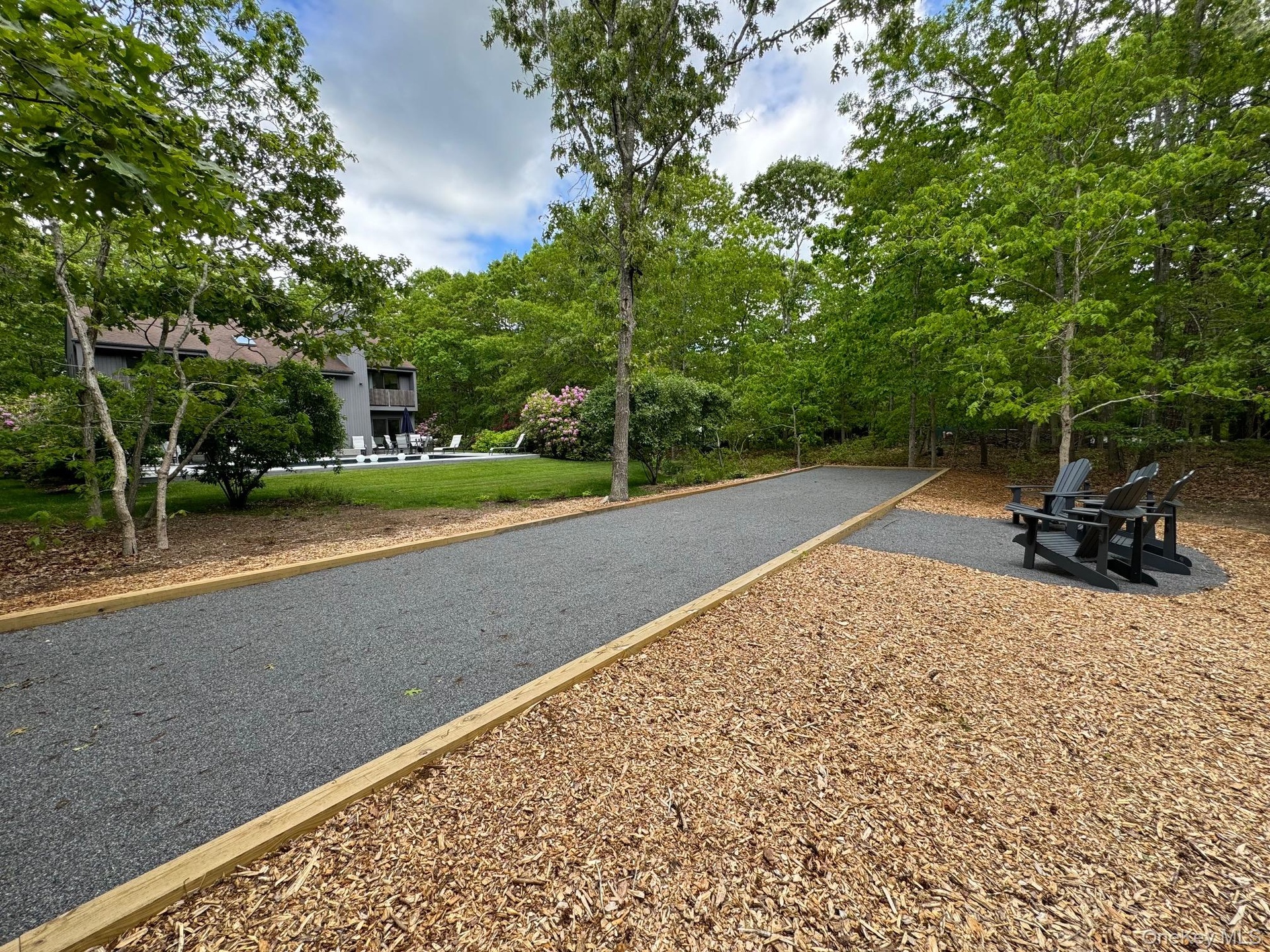 View of road featuring view of wooded area