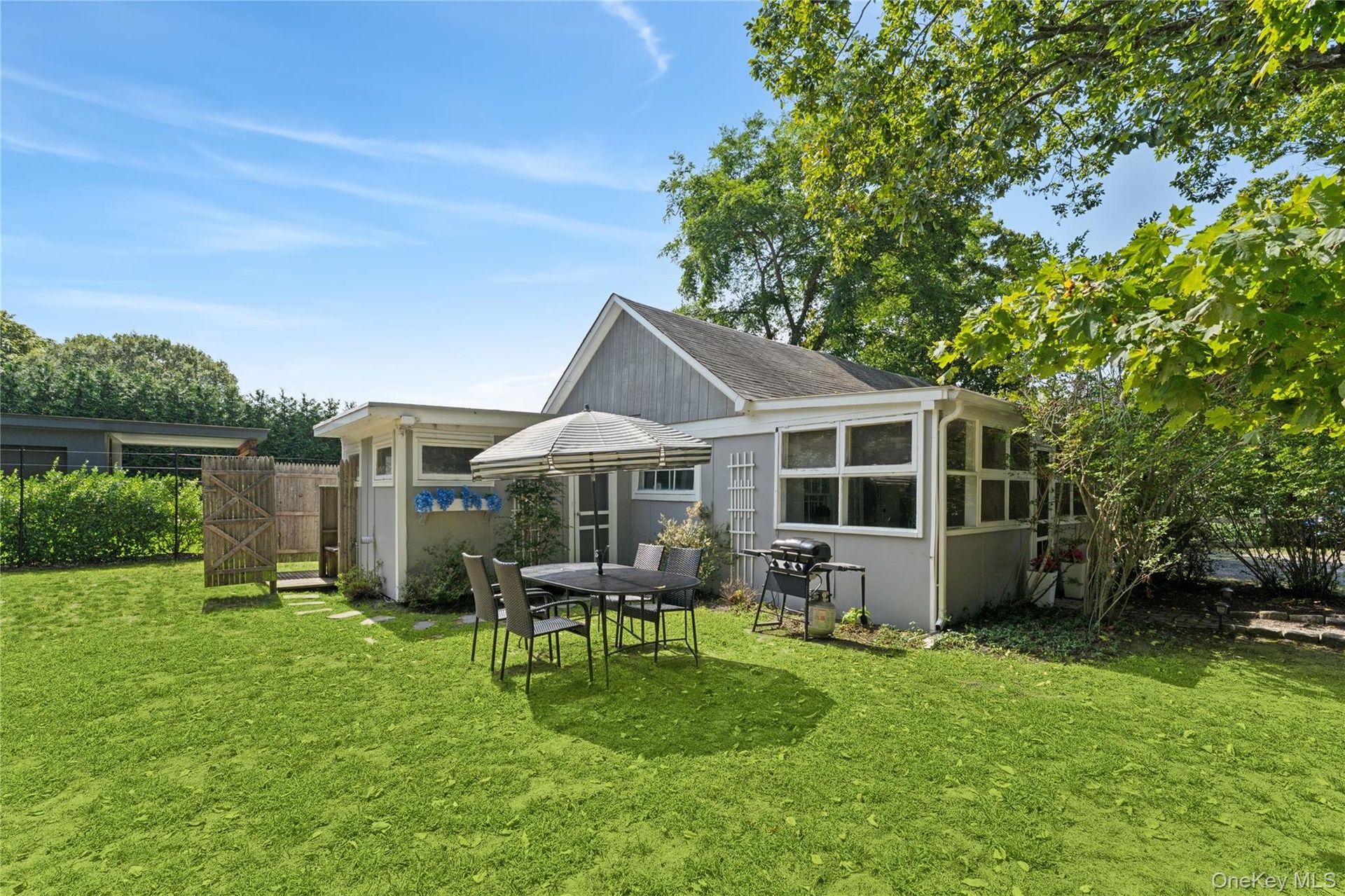Back Yard with seating, grill, and outdoor shower