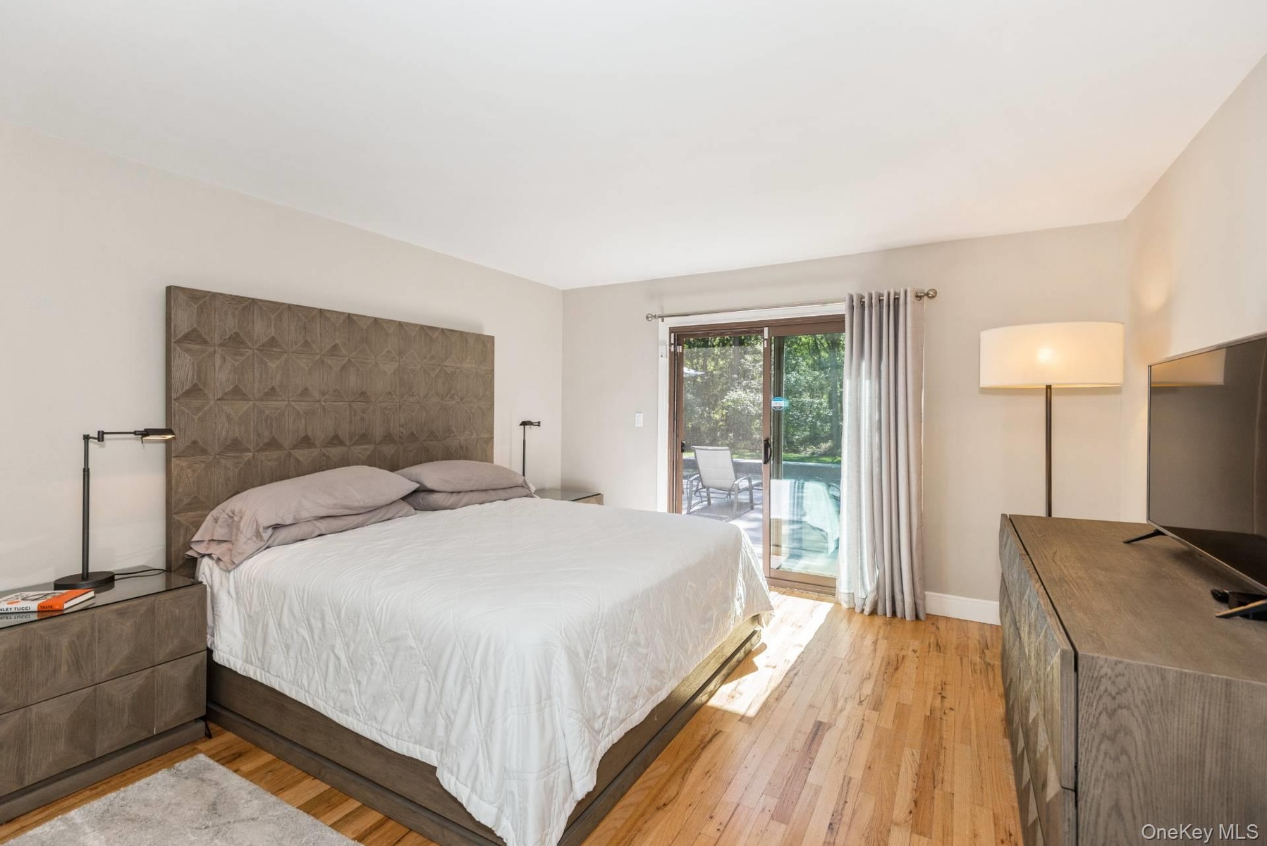 Bedroom with light wood-style flooring and access to outside