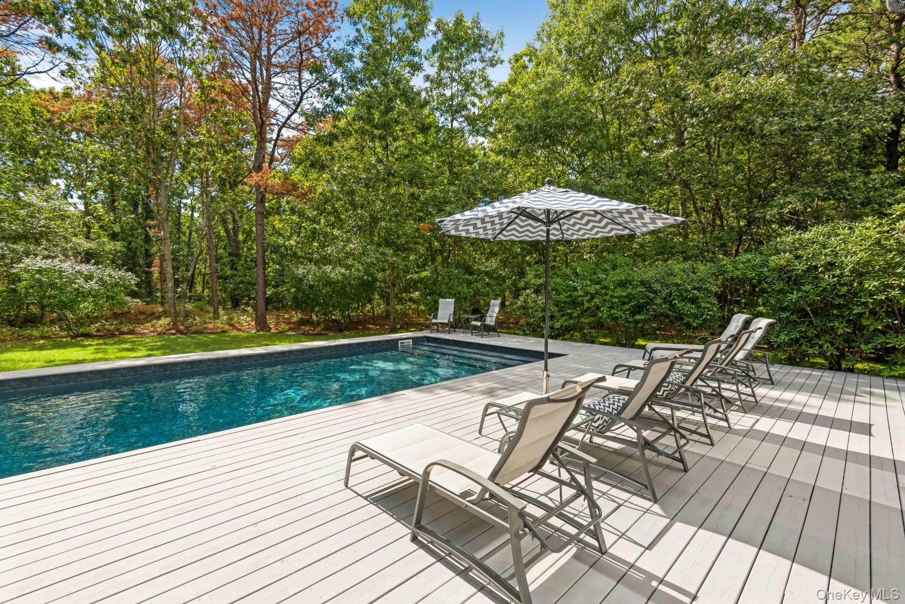 Outdoor pool featuring a wooden deck