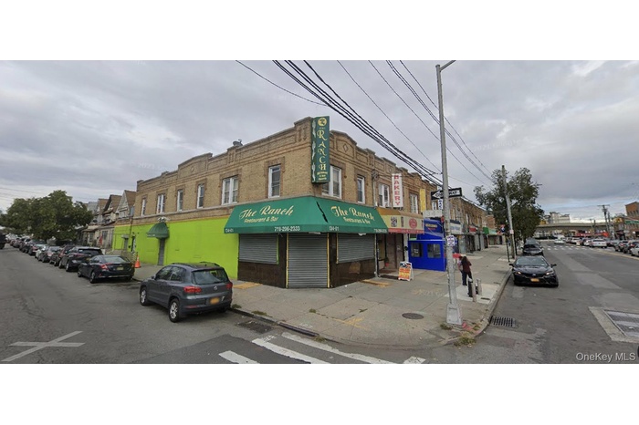 View of commercial property, 2 side entrances (1 for tenants and 1 side entry to the bar). Thriving businesses nearby.